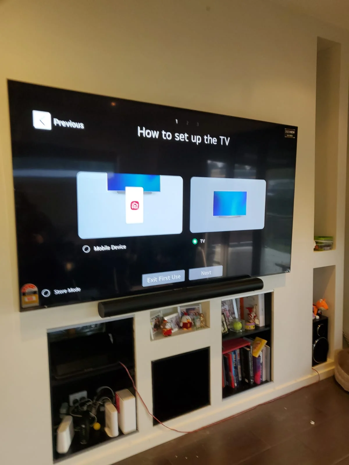 Modern living room setup with a mounted TV and sleek soundbar